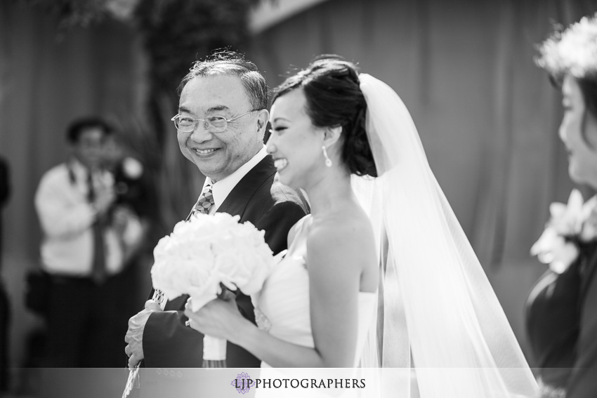13-serra-plaza-san-juan-capistrano-wedding-photographer-bride-walking-down-aisle-photo
